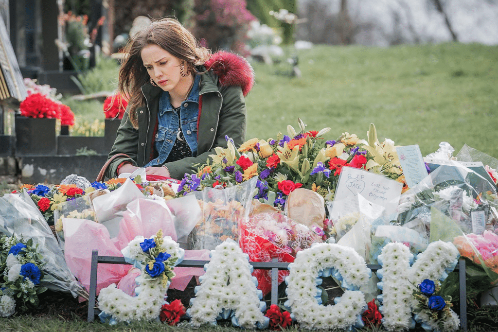 Image of flower tributes to Jack in Four Lives episode 3